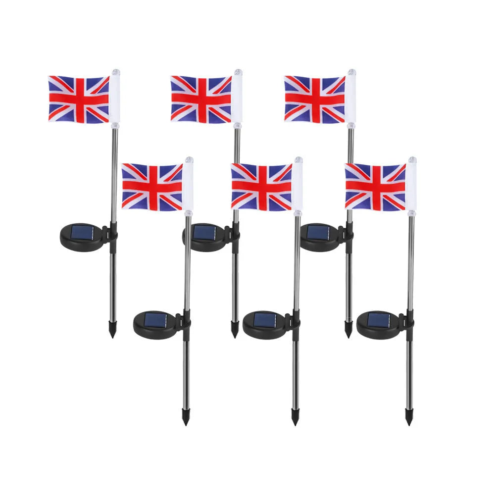 Solar garden flag light with stainless steel pole showing American flag design illuminated at night