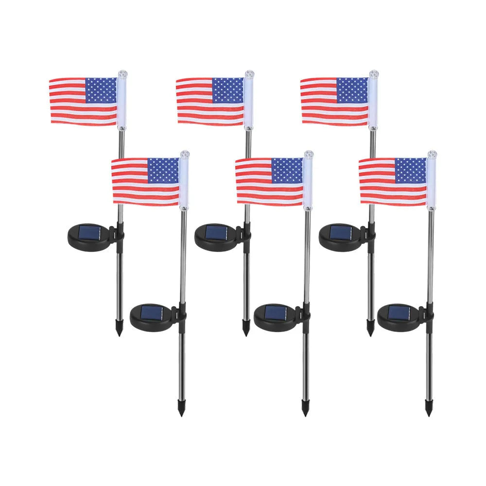 Solar garden flag light with stainless steel pole showing American flag design illuminated at night
