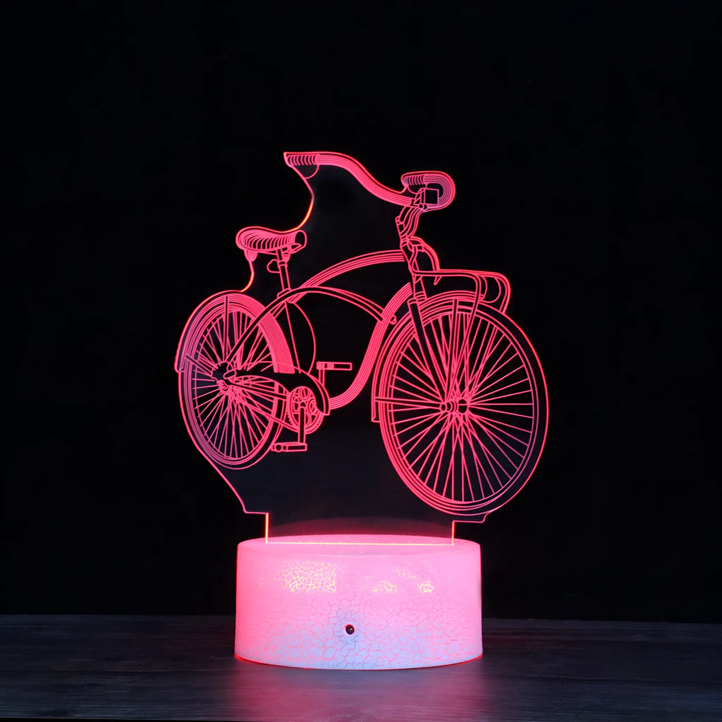 Bicycle series 3D night light with colourful LED glow on black base against dark background
