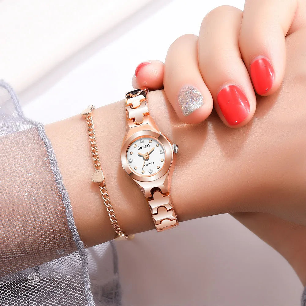 Small fine quartz ladies bracelet watch with round alloy case and stainless steel horseshoe buckle