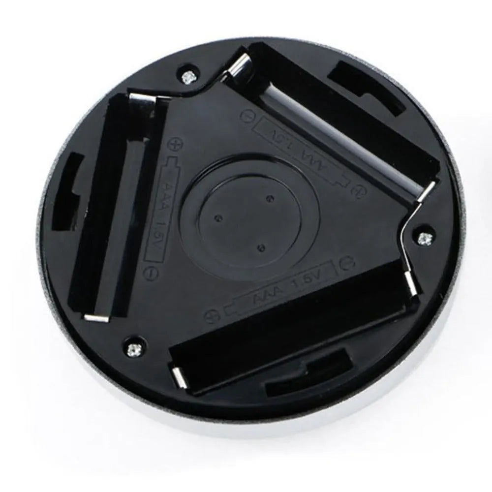 Silver square battery-operated motion sensor night light for automatic illumination.
