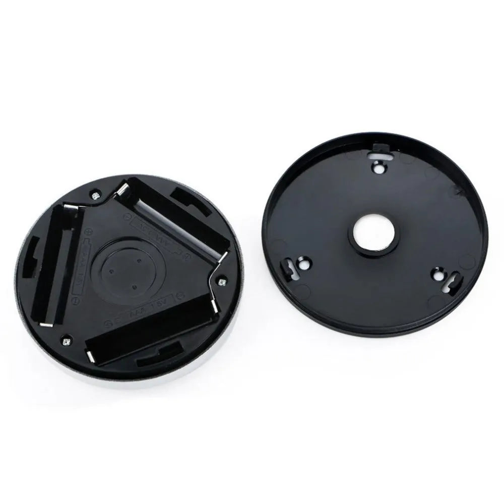 Silver square battery-operated motion sensor night light for automatic illumination.