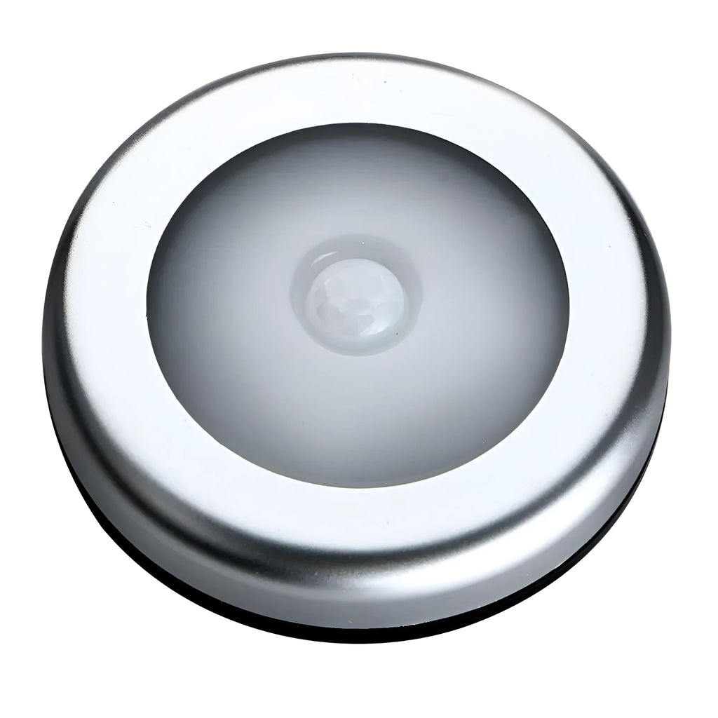 Silver square battery-operated motion sensor night light for automatic illumination.
