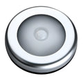 Silver square battery-operated motion sensor night light for automatic illumination.