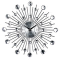 Large silver round wall clock with aluminium dial on a wall