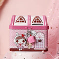 Blue house-shaped tinplate piggy bank on desktop showing round form and coin slot