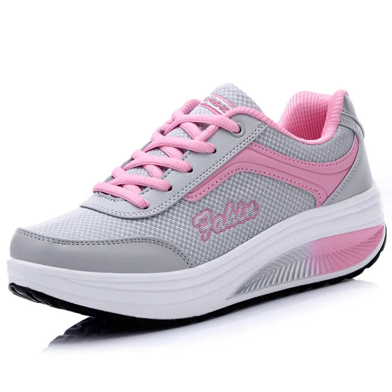 Women's grey powder travel sports shoes with a 3-5cm mid-heel on a neutral background.