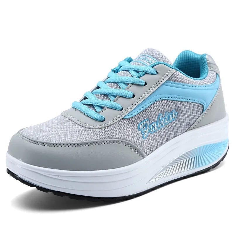 Women's grey powder travel sports shoes with a 3-5cm mid-heel on a neutral background.