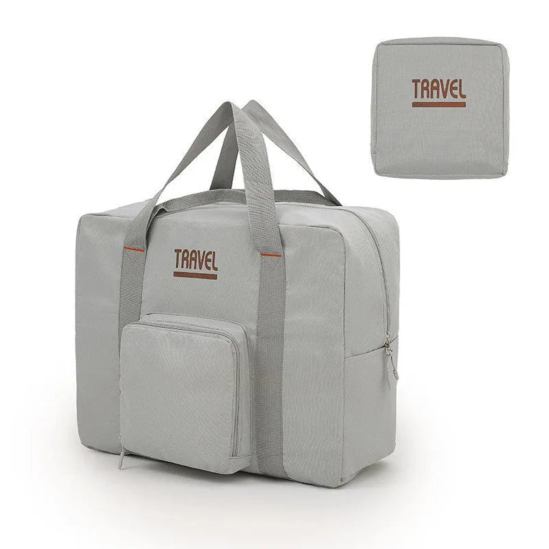 Black cube-shaped travel bag made from Oxford cloth with a sealable top.