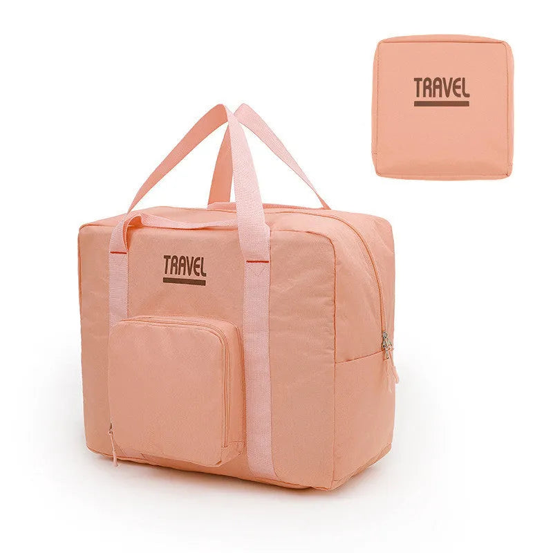 Black cube-shaped travel bag made from Oxford cloth with a sealable top.