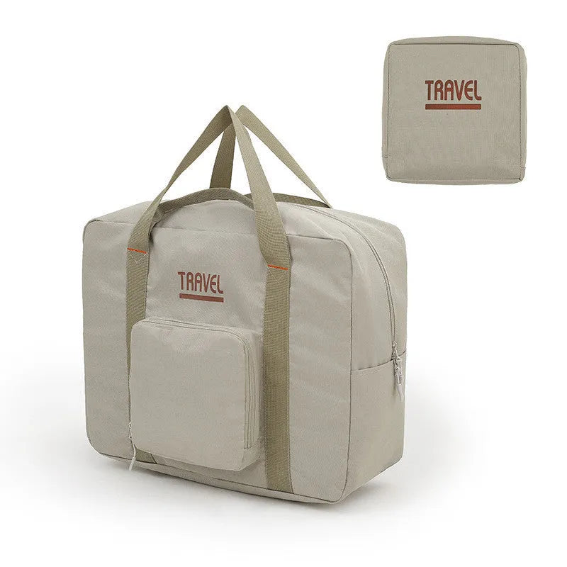 Black cube-shaped travel bag made from Oxford cloth with a sealable top.