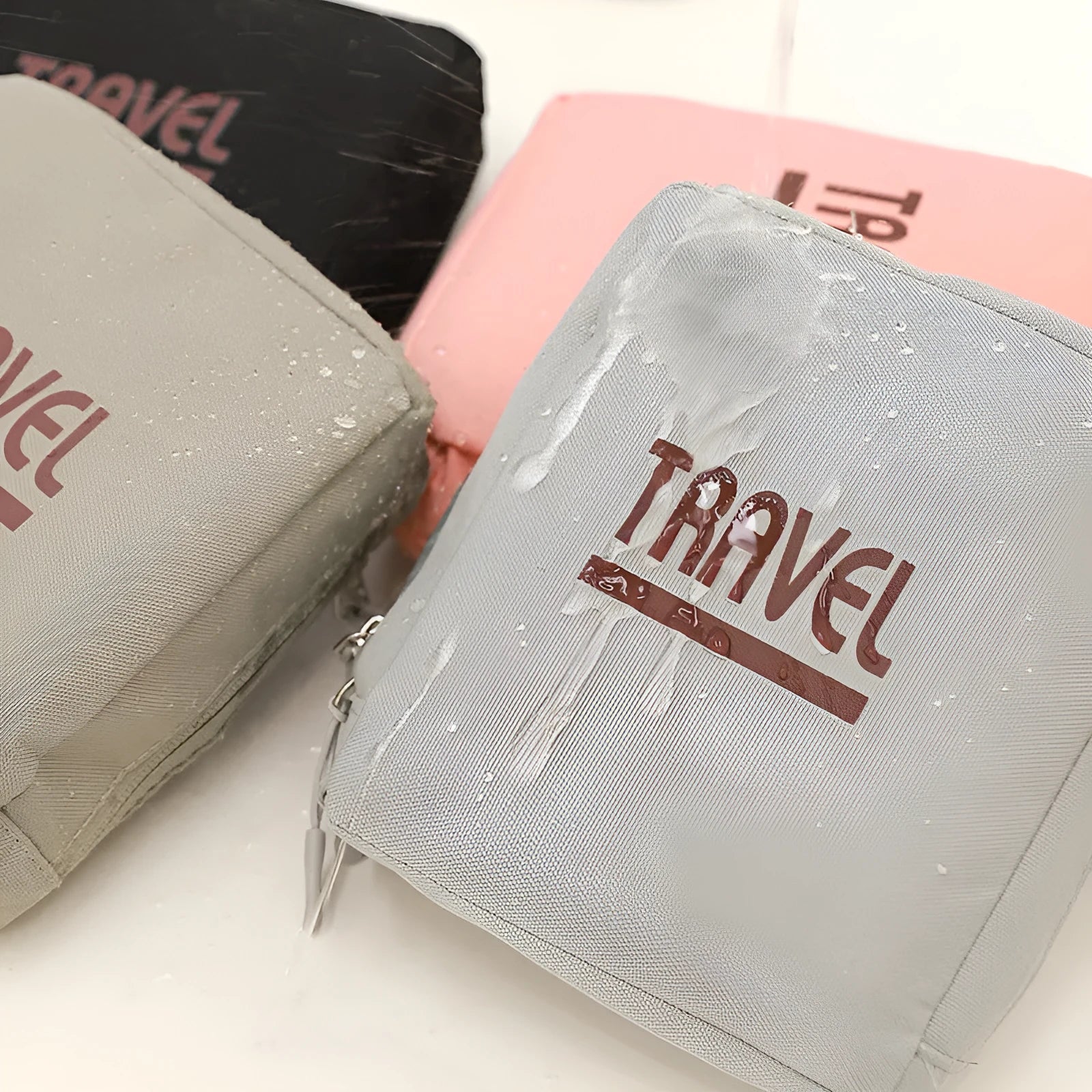 Black cube-shaped travel bag made from Oxford cloth with a sealable top.
