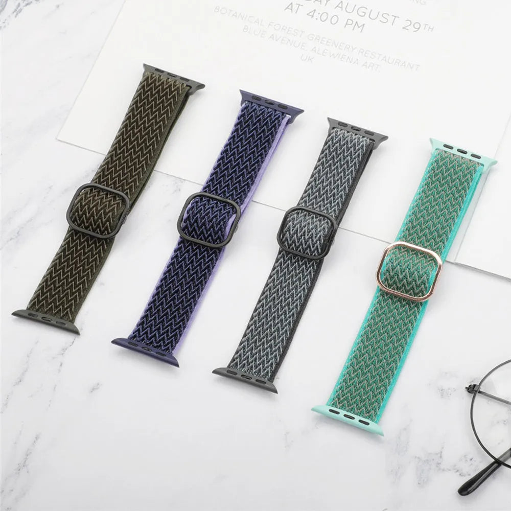 Braided nylon Apple Watch strap with wave pattern in multiple colours on a wrist