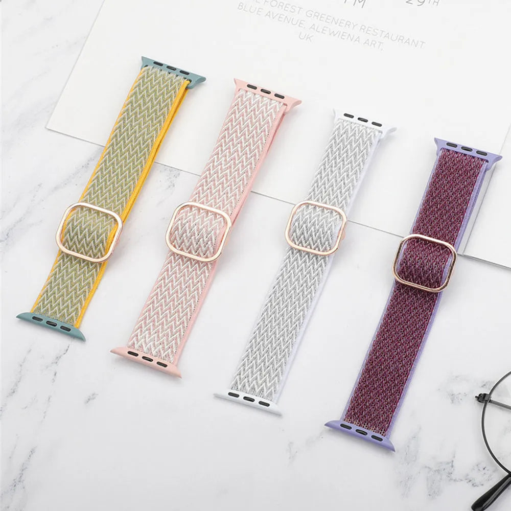 Braided nylon Apple Watch strap with wave pattern in multiple colours on a wrist