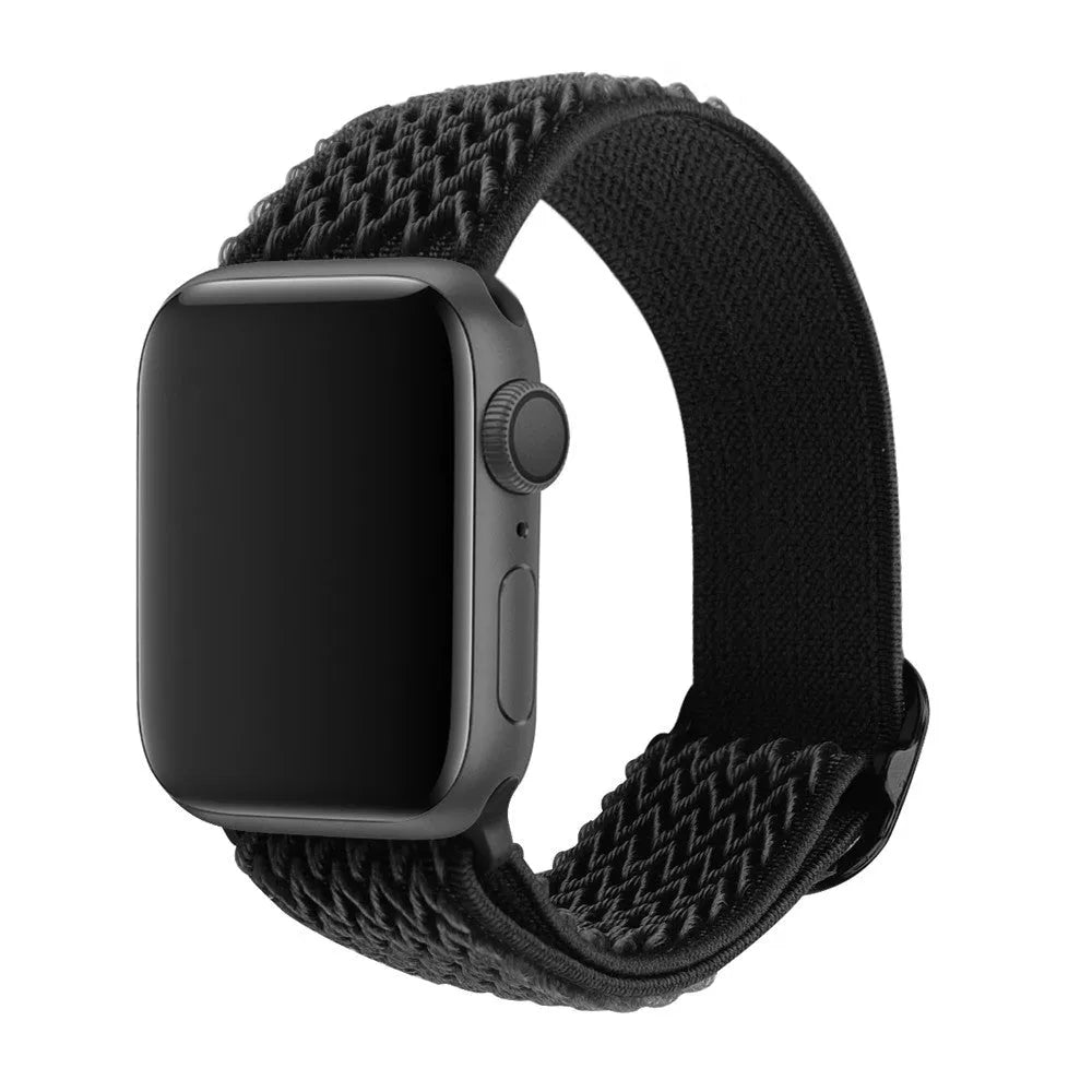 Braided nylon Apple Watch strap with wave pattern in multiple colours on a wrist
