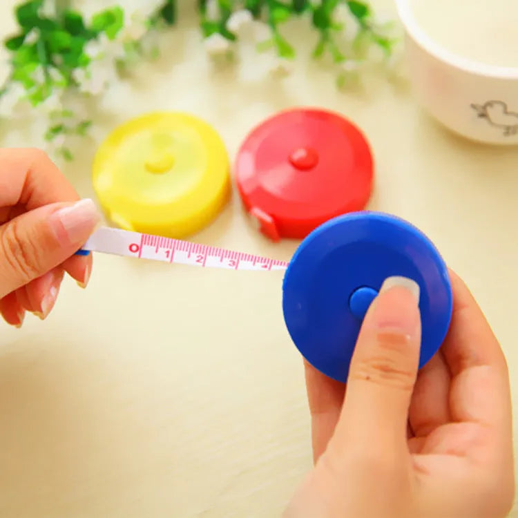 Mini plastic portable measuring tape 150cm with compact 5cm diameter and 1.2cm height