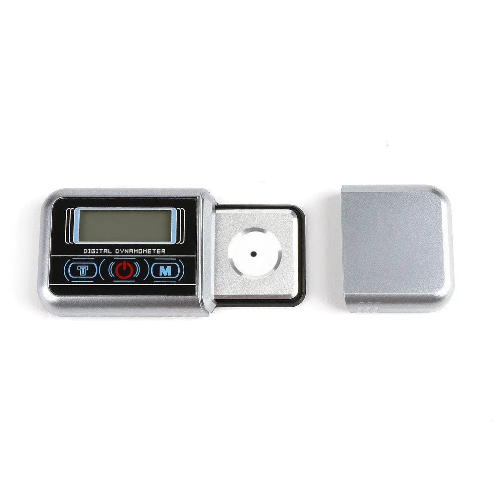 Compact black digital pocket scale on a table showing 0.00g on its LCD display.