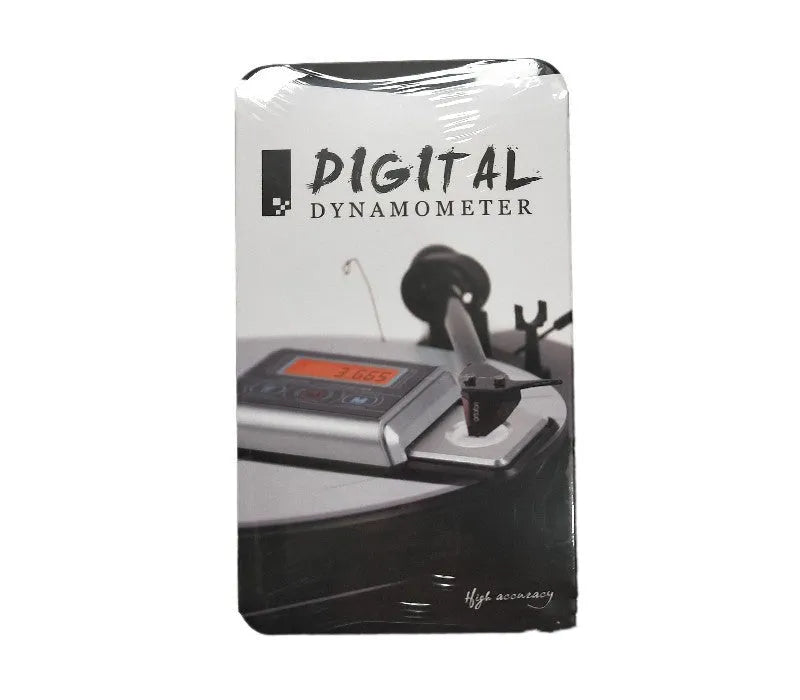 Compact black digital pocket scale on a table showing 0.00g on its LCD display.