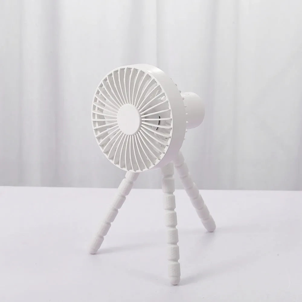 USB rechargeable portable desk fan with flexible octopus tripod and white colour option on a wooden table.