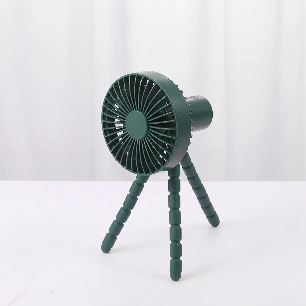 USB rechargeable portable desk fan with flexible octopus tripod and white colour option on a wooden table.