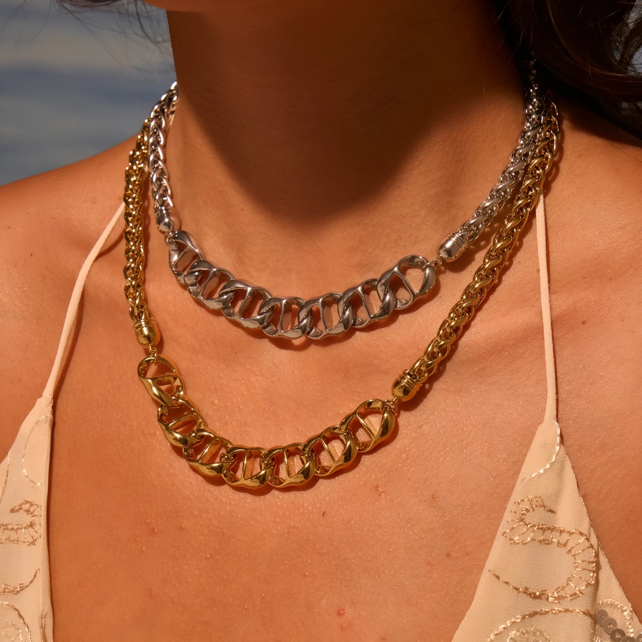 Stainless steel necklace with geometric pendant and electroplated 18K gold finish
