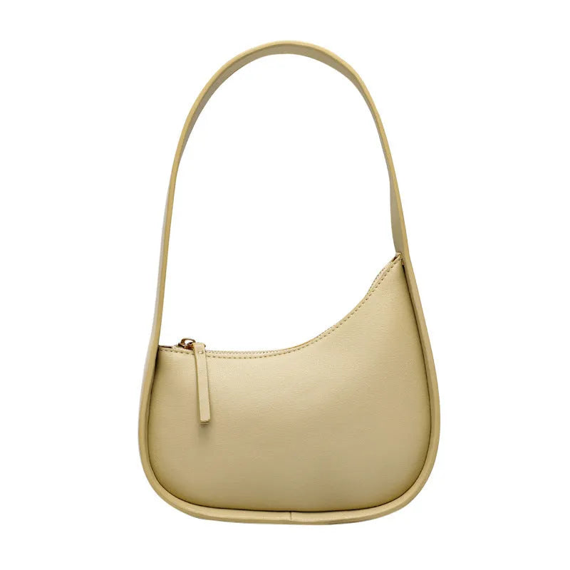 Genuine leather half moon women's handbag with wide shoulder strap in caramel colour
