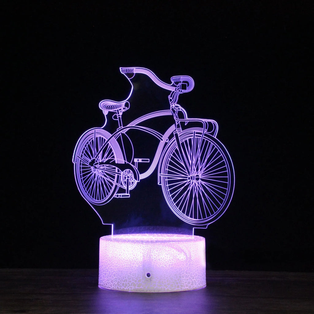Bicycle series 3D night light with colourful LED glow on black base against dark background