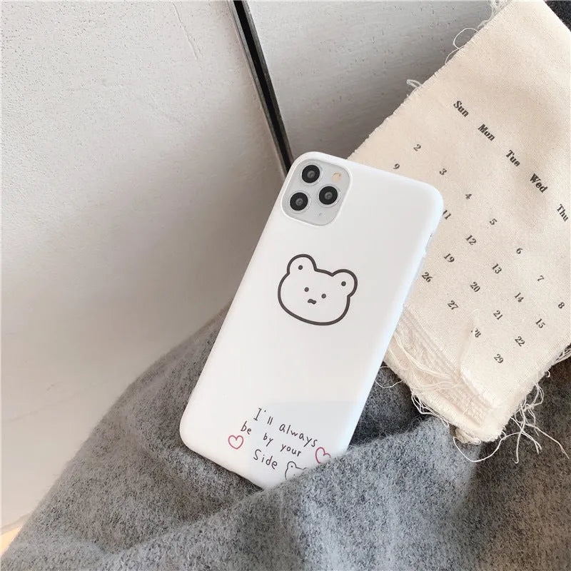 Soft silicone Apple iPhone case with a Korean bear cartoon design on the back.