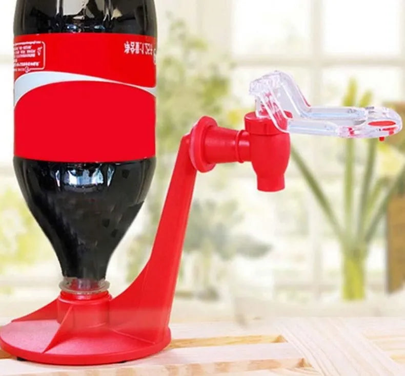 Red plastic Magic Tap soda dispenser attached to 2-litre bottle