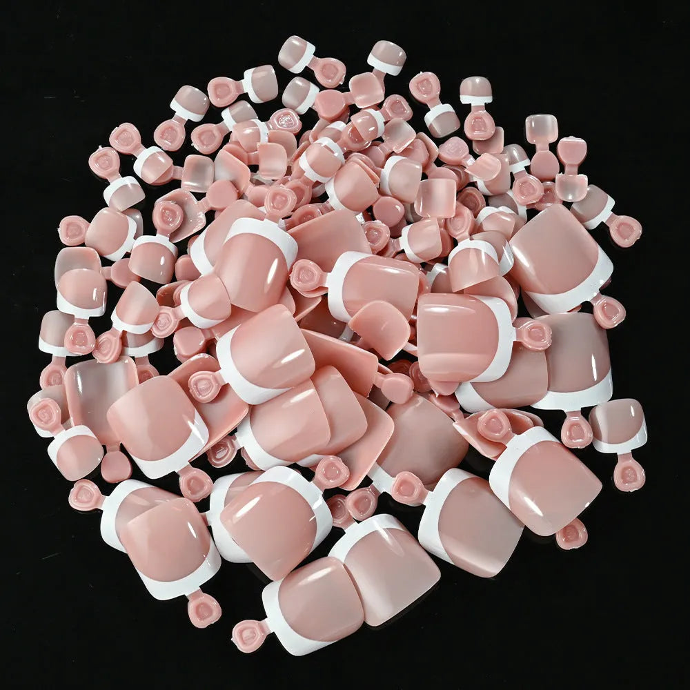 120-piece box of French white tip false toenails in nude colours, square short shape.