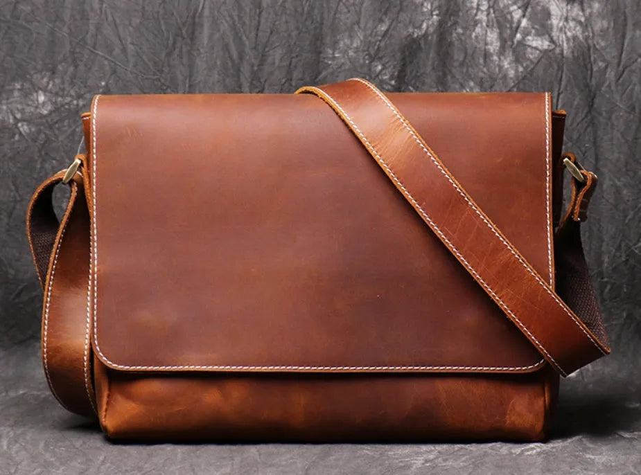 Men's vintage brown leather messenger bag with organised interior compartments and crossbody strap