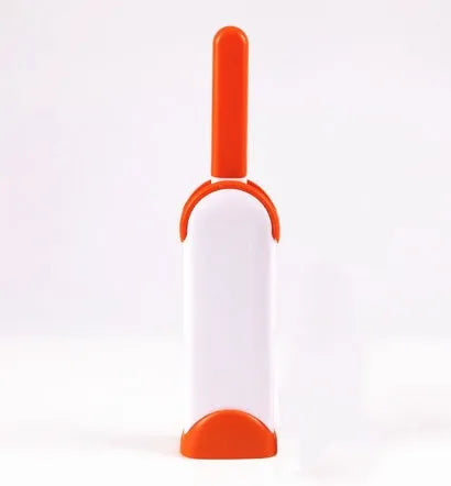 Blue reusable pet hair removal comb with double-sided flannel brush and self-cleaning base for sofas.