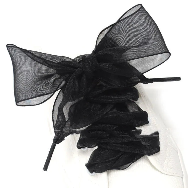 Wide transparent lace shoelaces in multiple solid colours showing 4cm width and length.
