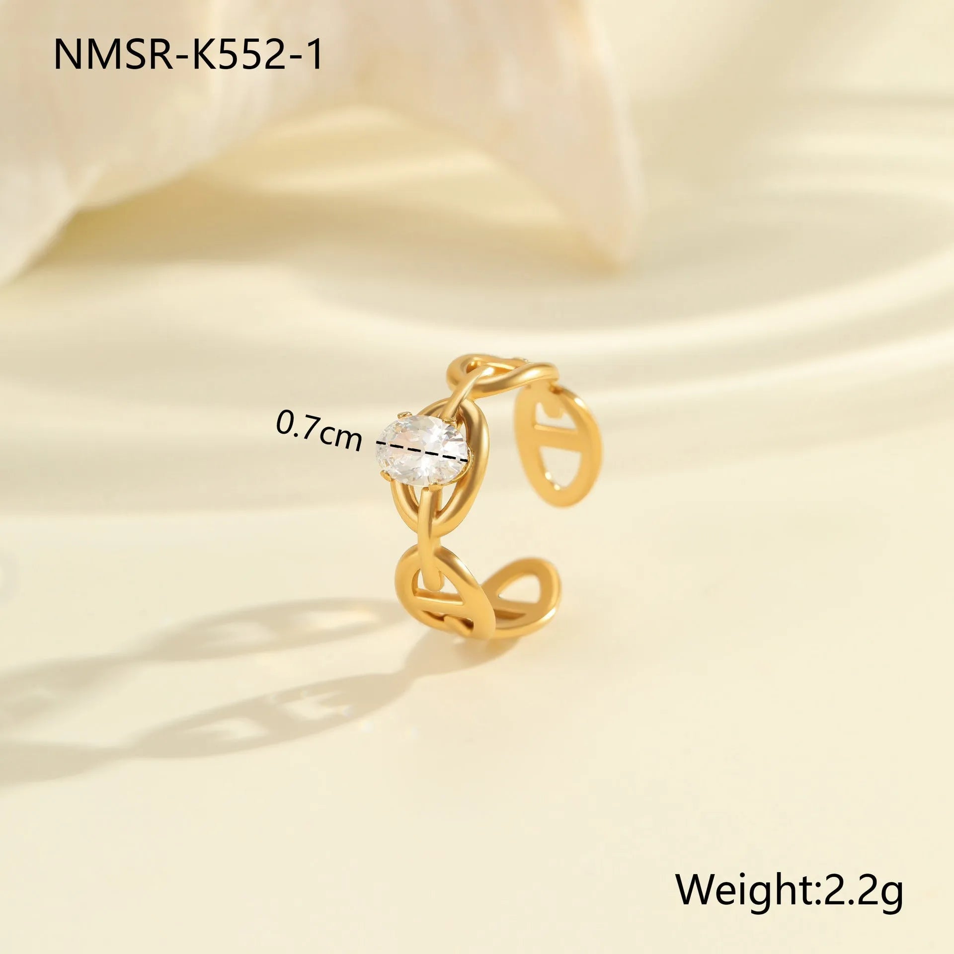 Women's geometric zircon ring with adjustable open mouth design on a hand.
