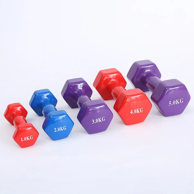 Colourful plastic-coated fitness dumbbells in bright colours for home workouts