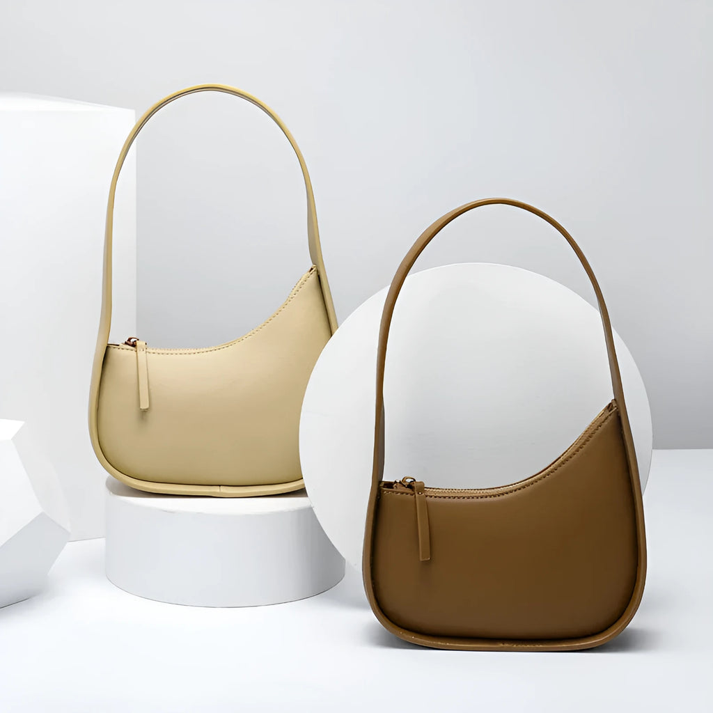 Genuine leather half moon women's handbag with wide shoulder strap in caramel colour
