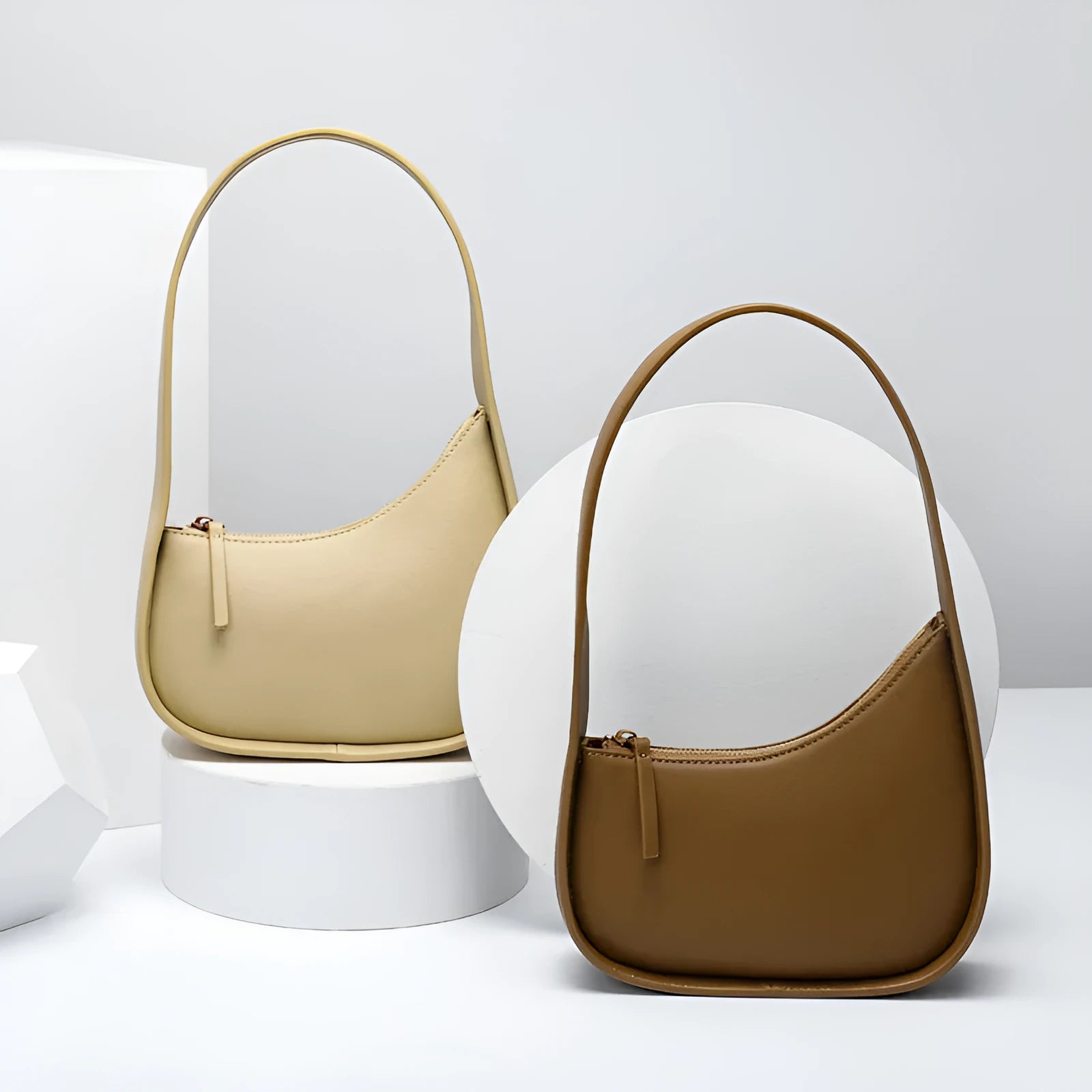 Genuine leather half moon women's handbag with wide shoulder strap in caramel colour