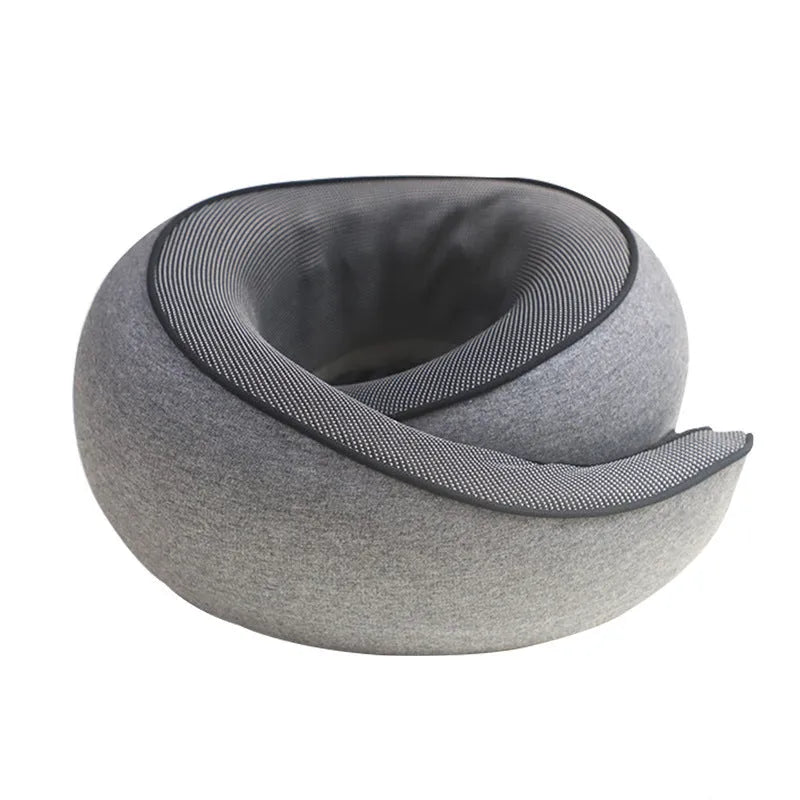 U-shaped grey memory foam travel neck pillow with a black storage bag on a plain background.