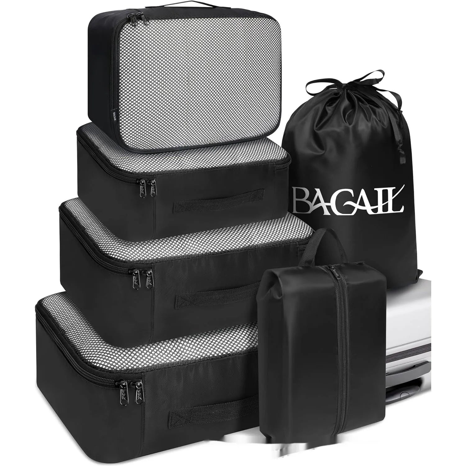 Set of eight cubic travel packing bags for underwear organisation in various colours including solid shades and patterns