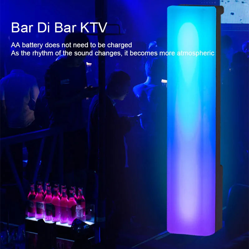 Black and white 3D RGB tabletop ambiance lamp with voice-activated rhythm lights for gaming and decor.