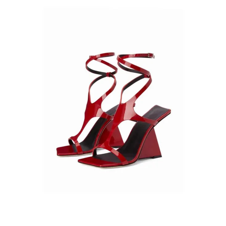Women's black heeled sandals with a square toe and 9.5cm high heel on a white background.