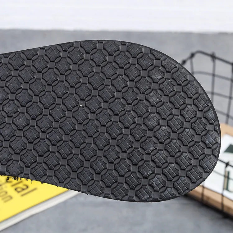 Women's brown bohemian summer slippers with a platform sole and elastic strap.