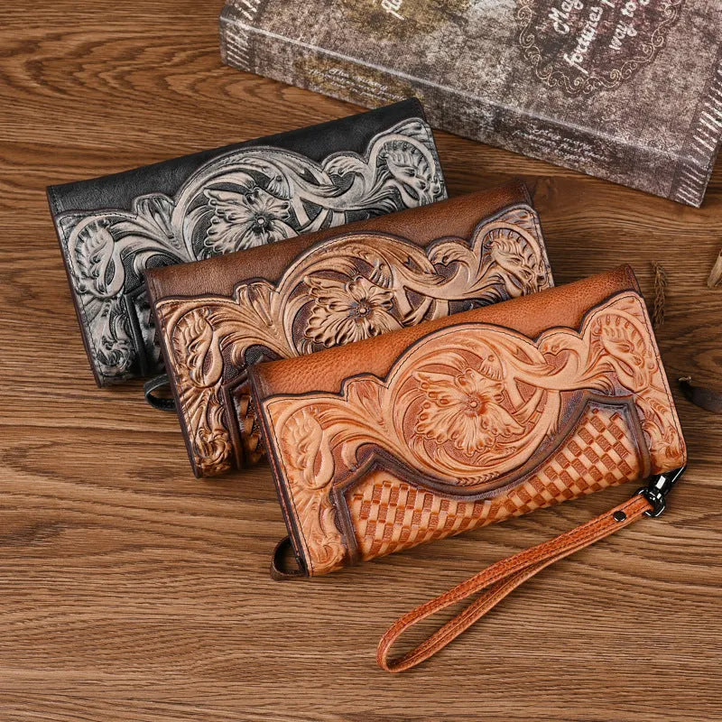 Women's brown genuine leather tri-fold wallet with embossed floral pattern showing open compartments