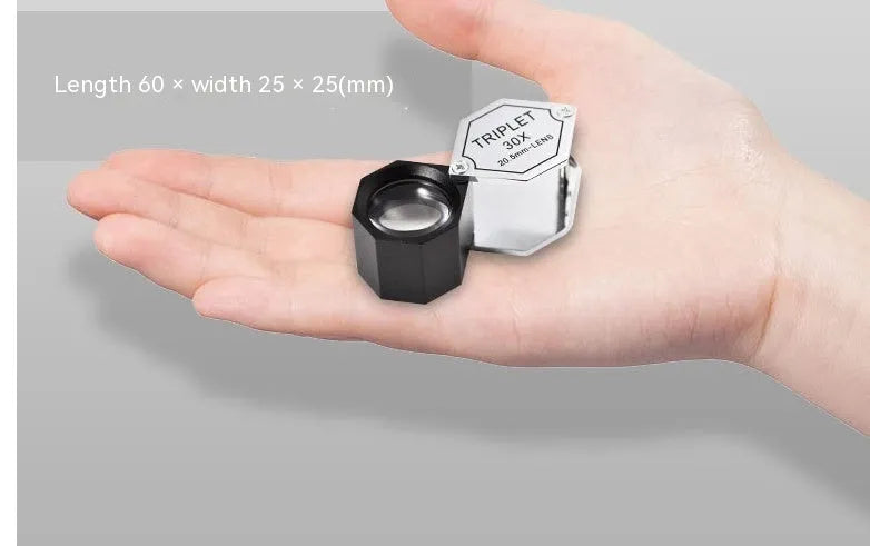 Handheld portable magnifying glass with metal body for jewellery and coin inspection