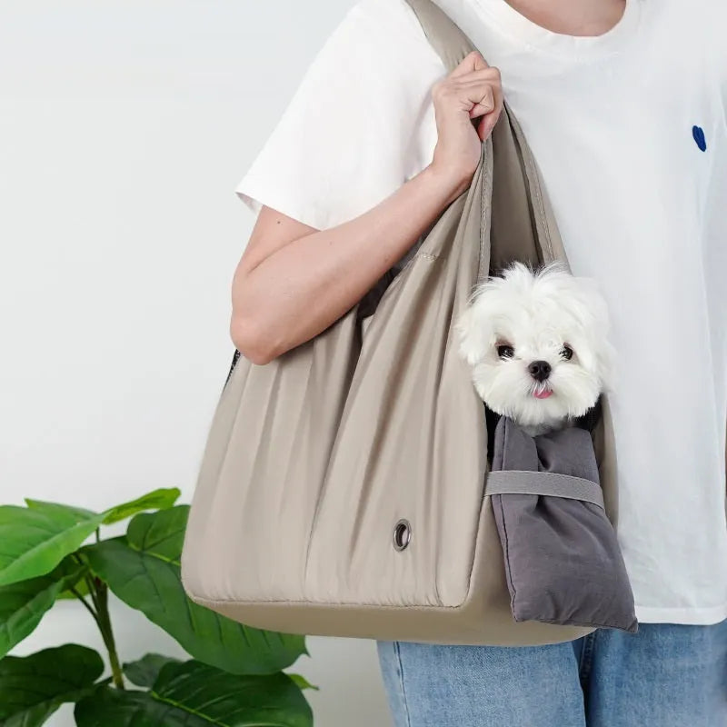 Apricot coloured cloth pet handbag measuring 41cm by 16cm by 28cm