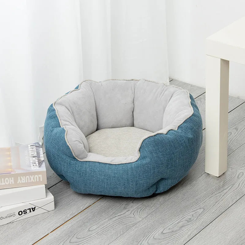 Blue octagonal pet sofa bed with a removable central mat for a small dog or cat.