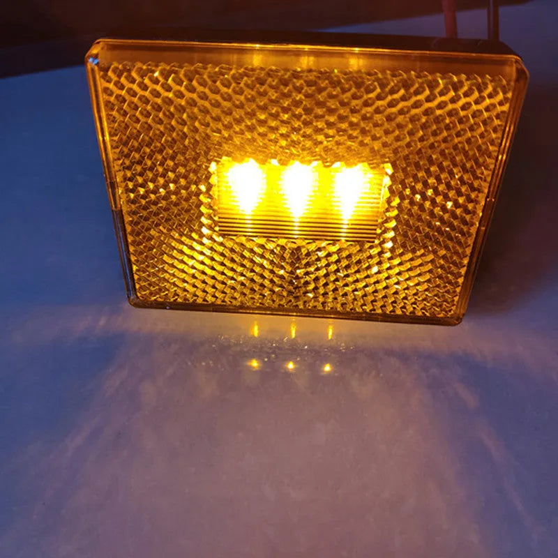 Red LED trailer side marker clearance lamp with 19cm wire on white background.