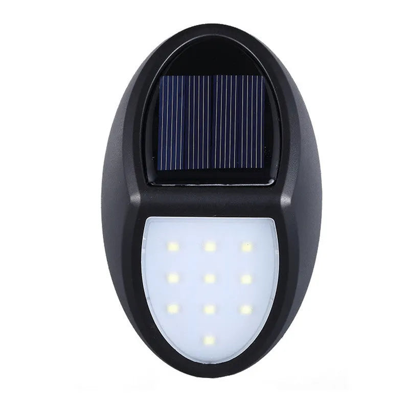 Black solar-powered LED wall light with solar panel and automatic activation