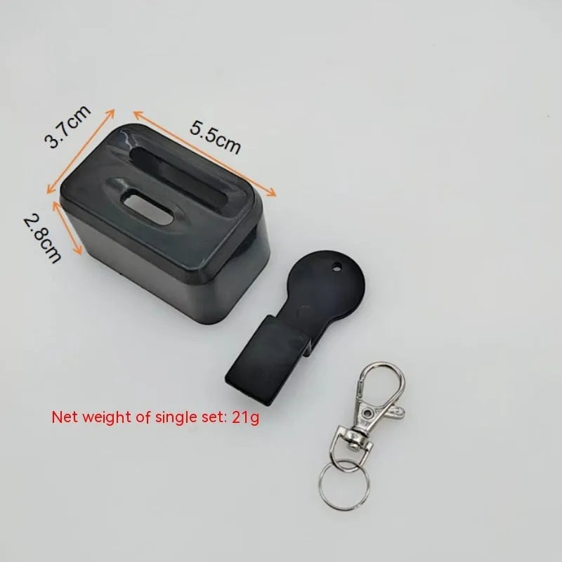 Black ABS plastic seat belt buckle clamp holder securing vehicle seat belt latch