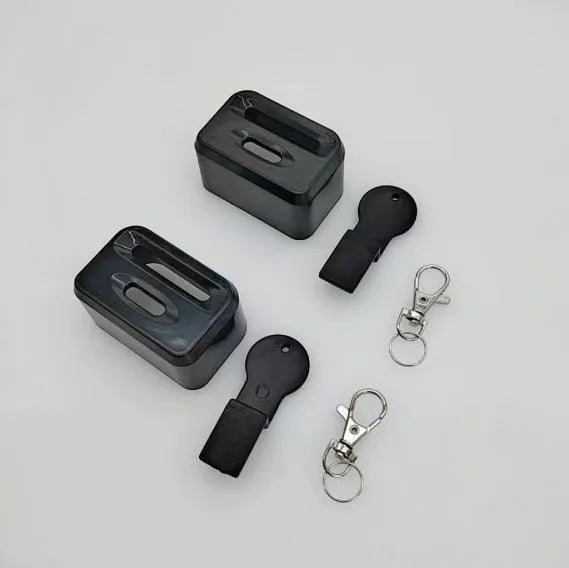 Black ABS plastic seat belt buckle clamp holder securing vehicle seat belt latch